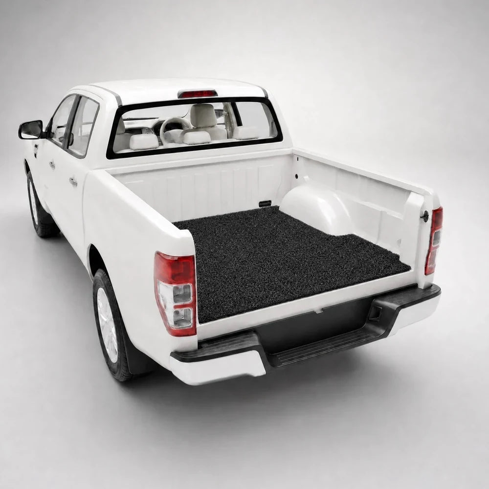 Shadow Black custom-fit mat following the shape of a ute tub