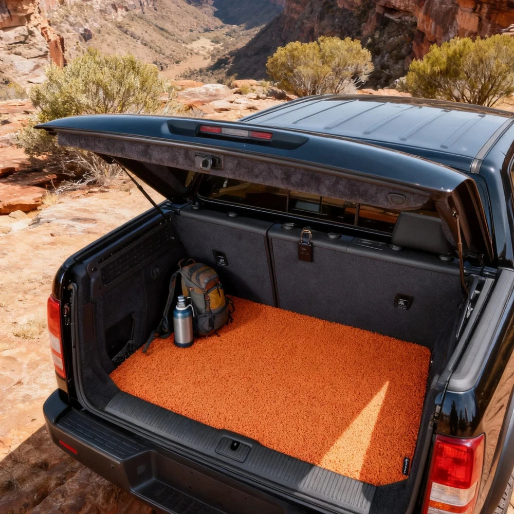 Tangerine Amber custom-fit coil mat installed in an Australian ute tub