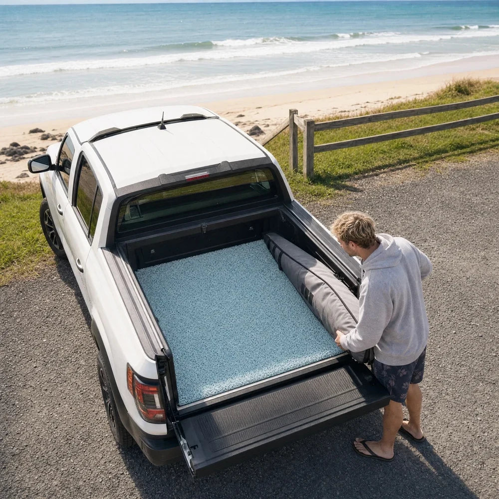 Ute fitted with a custom tub mat near the coast